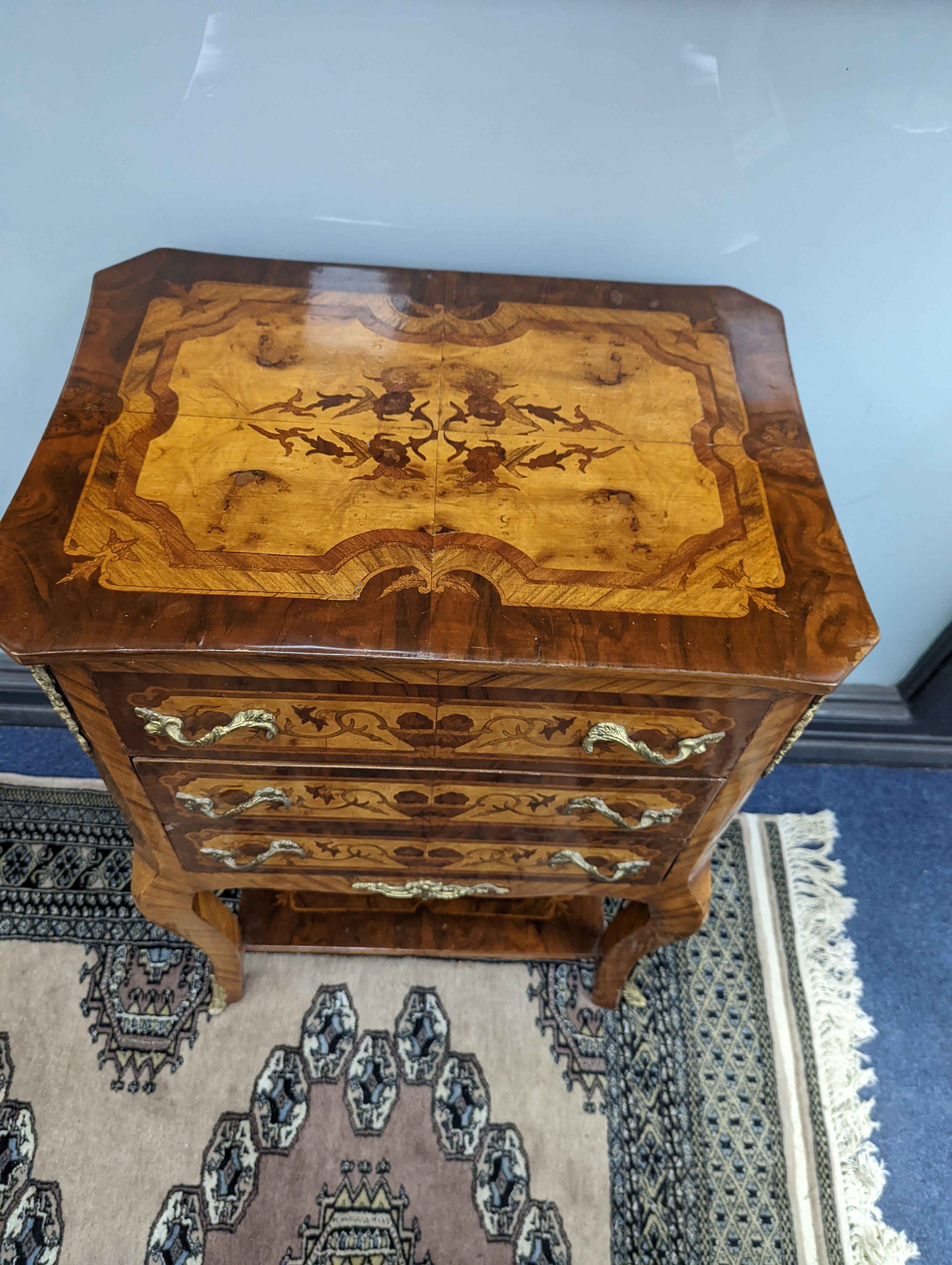 A pair of Louis XVI style marquetry bedside chests, each fitted with a two side drawers above two front long drawers, width 53cm, height 75cm